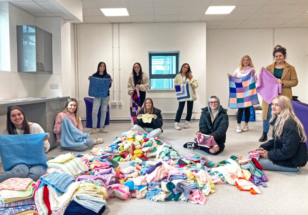 Exeter College students collect knitted baby items for charity